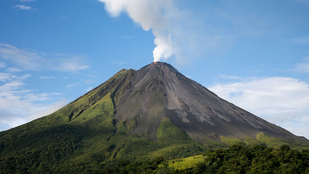Arenal volcano in costa rica with a plume of smoke. ©acanonguy.