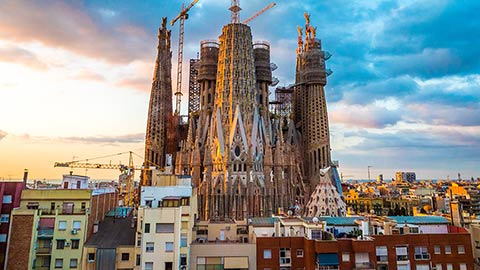 Colourful Sagrada Familia church during sunrise in Barcelona.