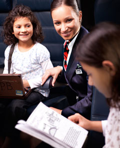 Cabin crew with two girls on board.
