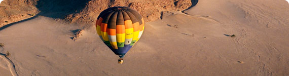 Hot air baloon over desert.