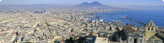 Colourful balloons with statue in background.