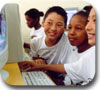 Children playing at a computer.