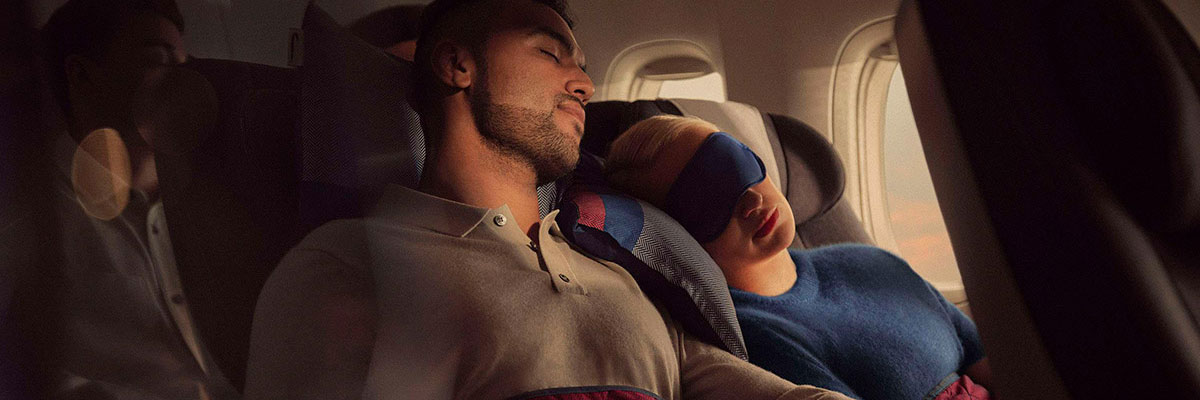 Couple sleeping in World Traveller Plus.