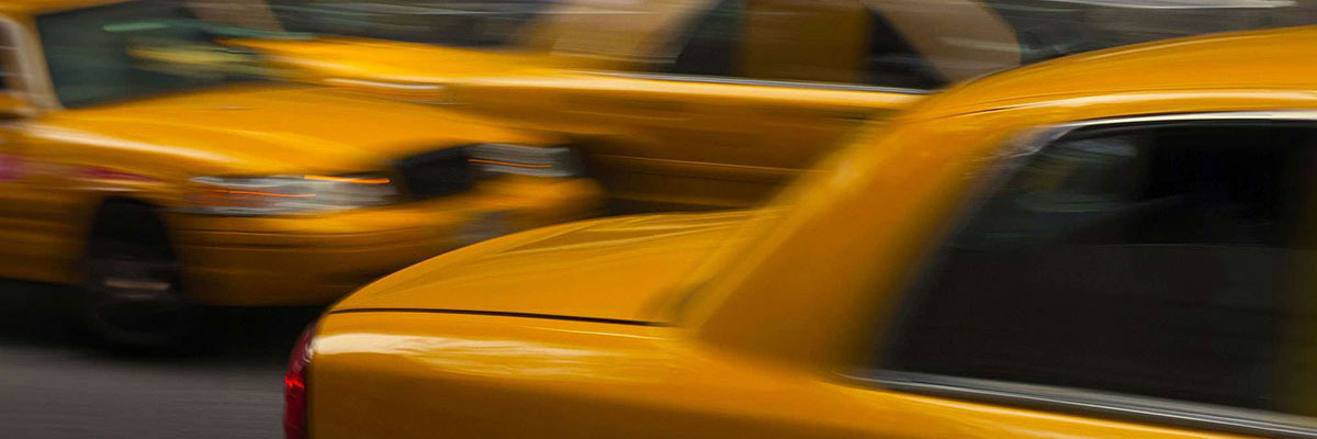 Blurred view on New York yellow taxis.