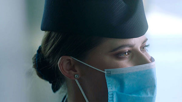 Close up of BA Cabin Crew wearing face mask.