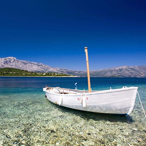 A small fishing boat tied into harbour on a beautiful sea, Korcula Island.