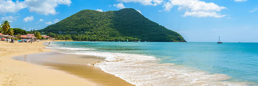 Reduit Beach - Tropical coast on the Caribbean island of St. Lucia. It is a paradise destination with a white sand beach and turquoiuse sea.