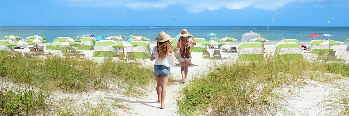 Girls walking on the beach on summer vacation.