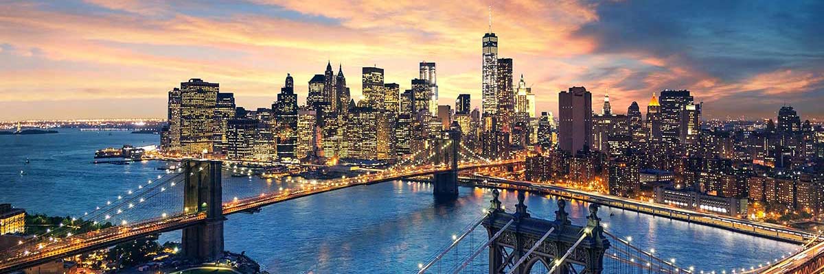 New York City - beautiful sunset over Manhattan with Manhattan and Brooklyn bridge.