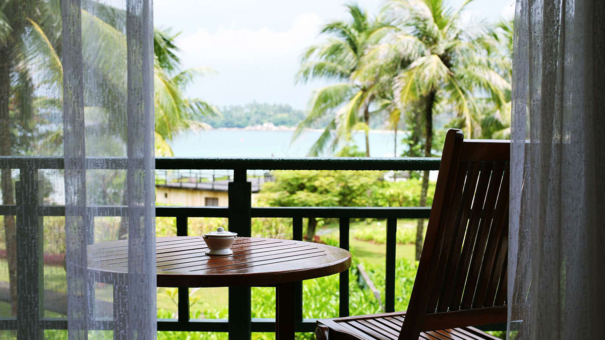 Lawn chair facing a great tropical sea view.