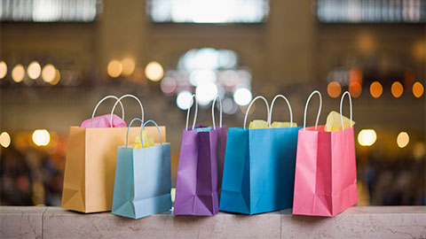 Different shopping bags in a row.