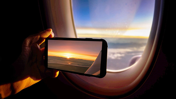 Sunset seen through the window of a plane.