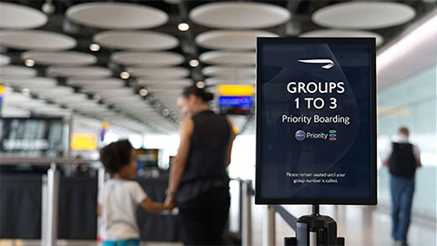 A family boarding at priority boarding.