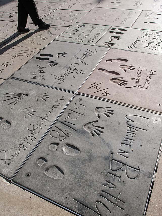 Step around famous footprints at the TCL Chinese Theatre, Hollywood. © Paul Quayle / Alamy Stock Photo.