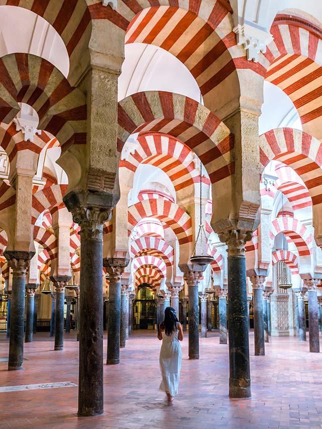 Woman walking inside the Mezquita of Cordoba. ©Matteo Colombo.