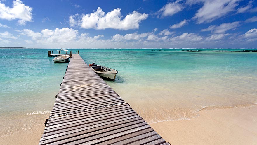 A wooden jetty stretching off from Ile Aux Cerfs, off the East Coast of Mauritius. © Lee Frost.