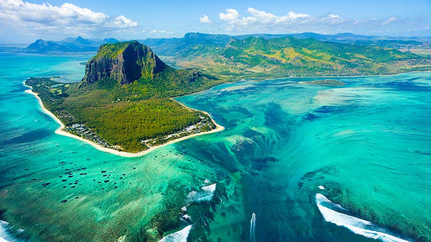 Take a boat over the 'underwater waterfall', in the shadow of the Le Morne Brabant mountain, Mauritius. © Myroslava.