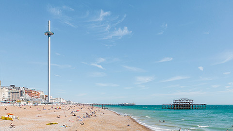 Wide shot of the BA i360 on Brighton beach.