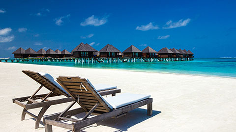 Beautiful beach with water bungalows at Maldives.
