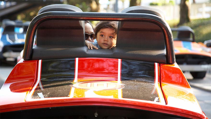 Child and parent in bumper car.