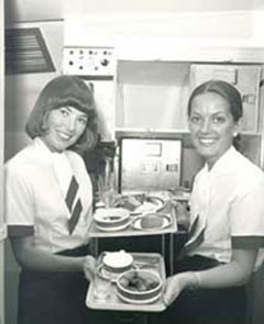Cabin crew displaying food available on Concorde.